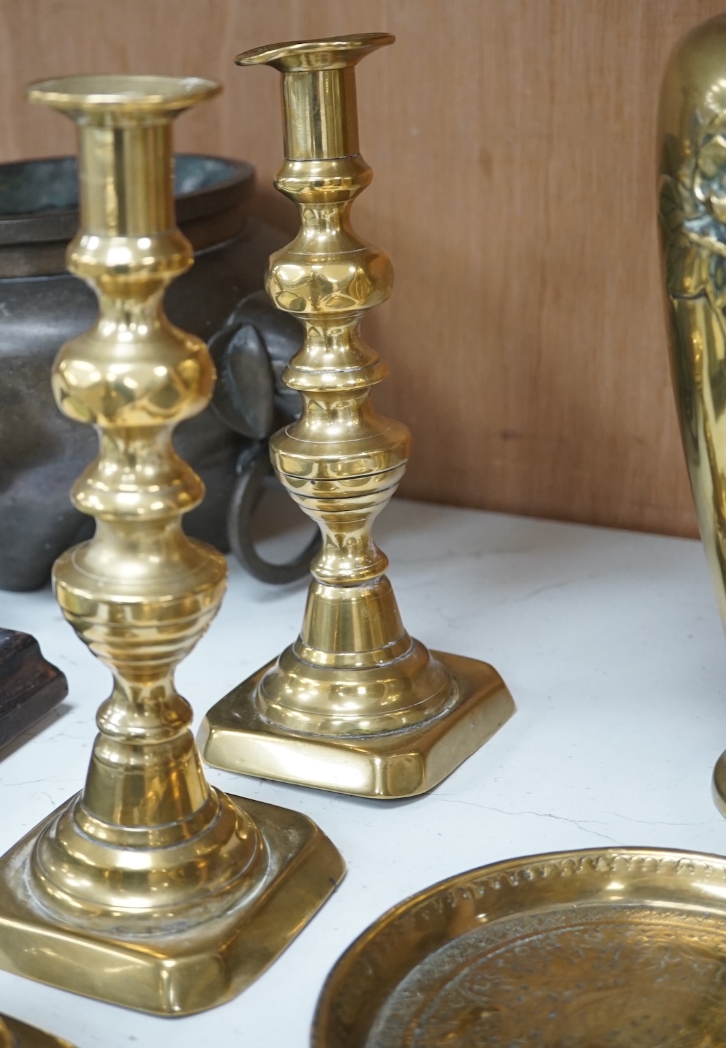 A Dutch repousse coal bin and cover, two pairs of candlesticks, a vase and two dishes, coal bin 43cm high. Condition - cover to bin wrapped slightly